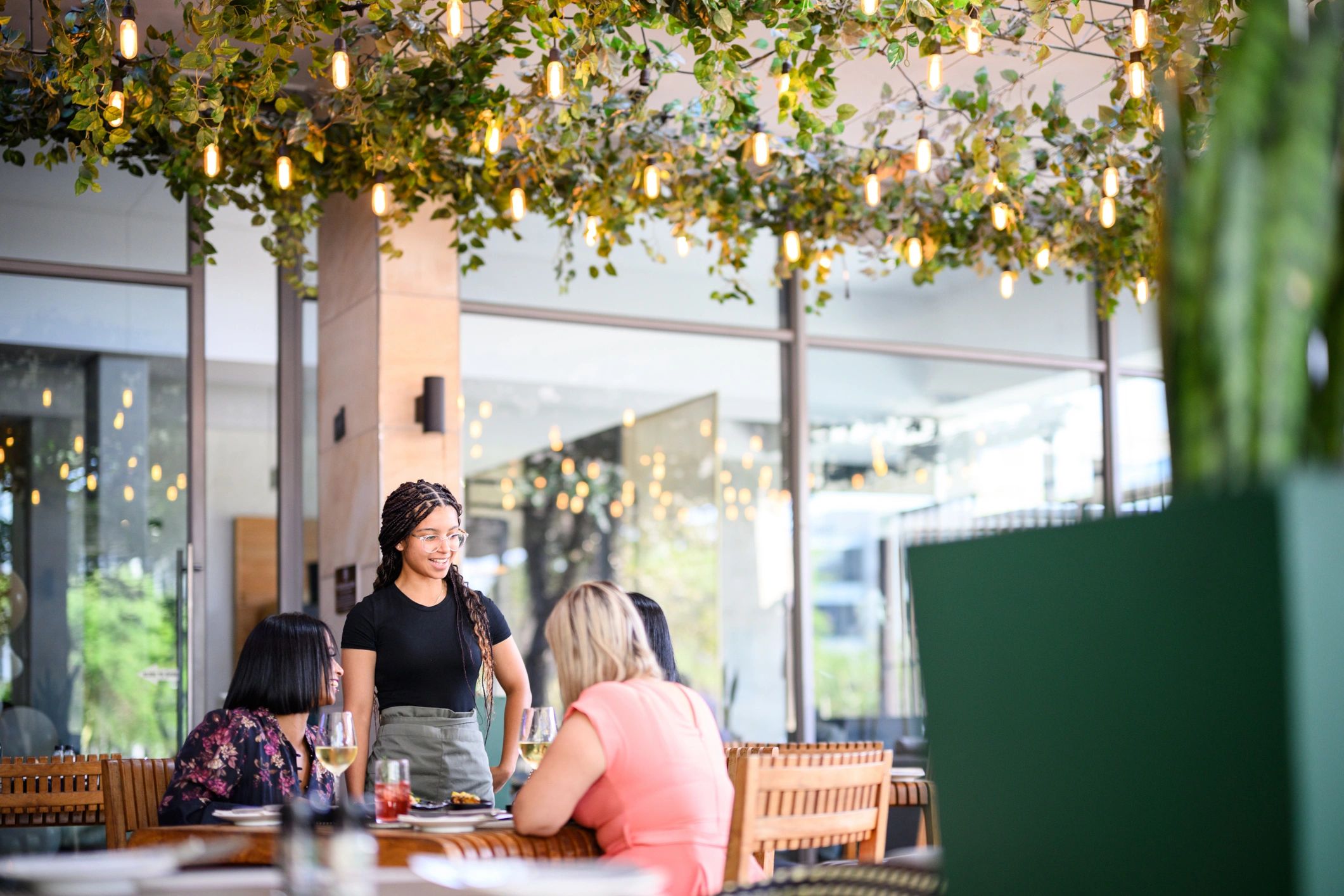 Guests enjoying a group celebration at a restaurant venue